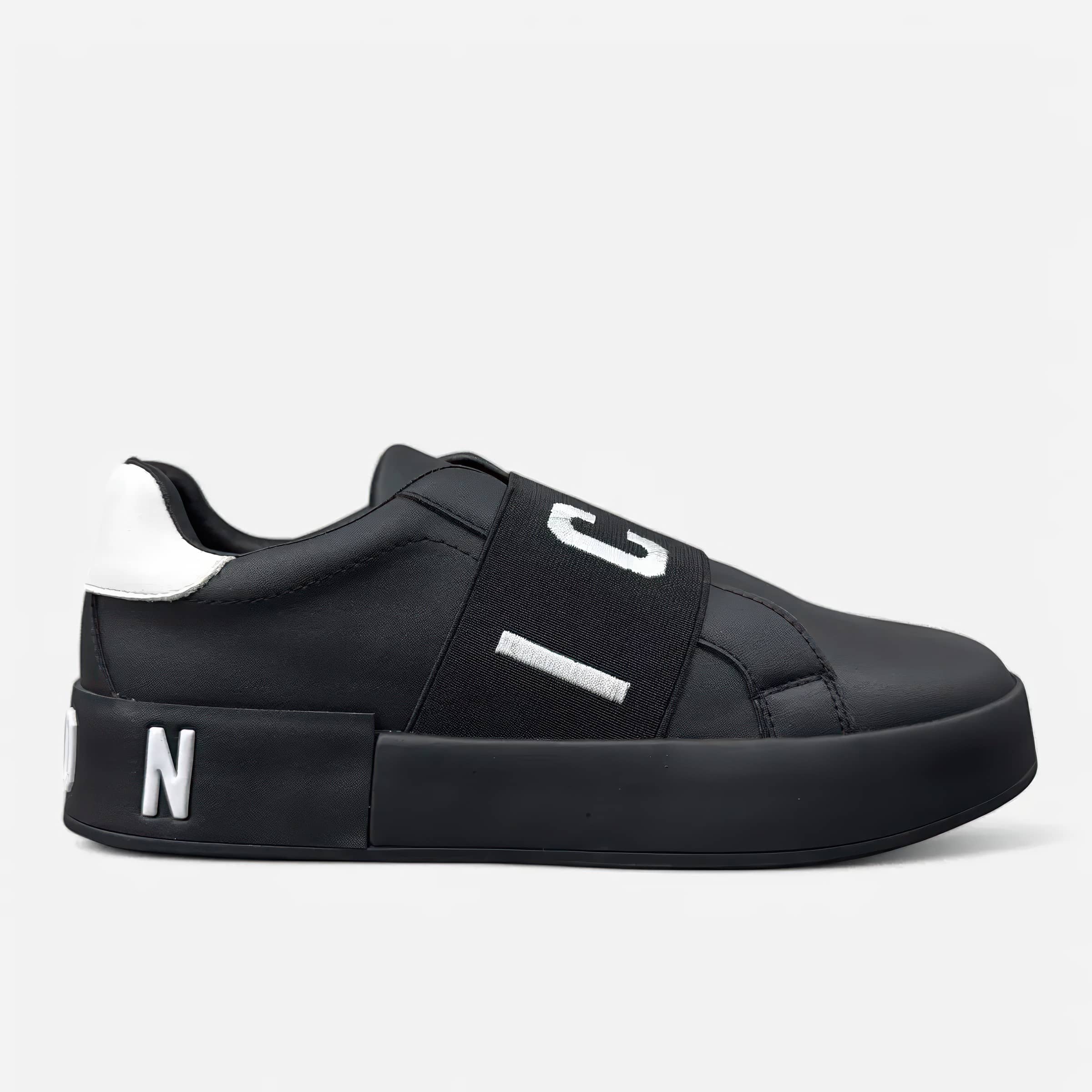 Black platform sneaker with elastic strap and white lettering
